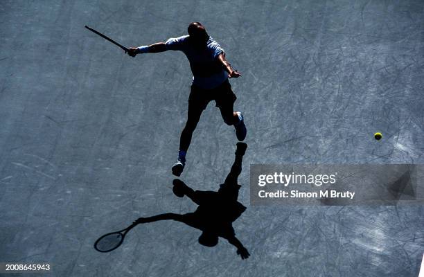 Andre Agassi of the United States of America hits a forehand during the 1999 U.S. Open at USTA National Tennis Center September 12th, 1999 in New...