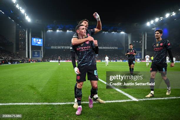 Phil Foden of Manchester City celebrates with Ruben Dias of Manchester City after scoring his team's third goal during the UEFA Champions League...