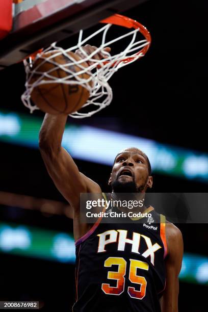 Kevin Durant of the Phoenix Suns dunks the ball during the game against the Utah Jazz at Footprint Center on February 08, 2024 in Phoenix, Arizona....