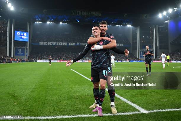 Phil Foden of Manchester City celebrates with Ruben Dias of Manchester City after scoring his team's third goal during the UEFA Champions League...