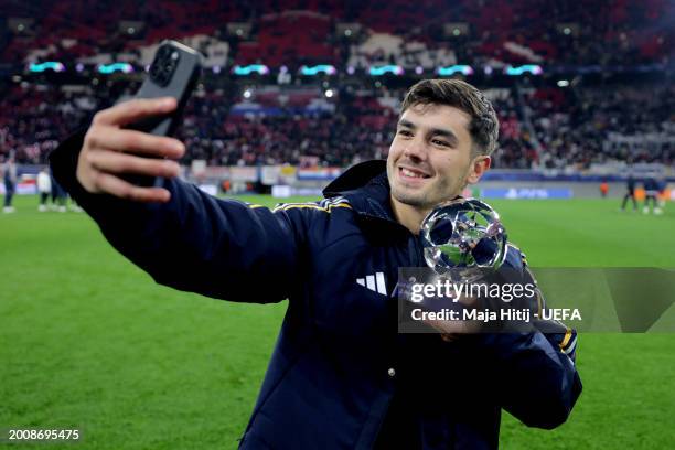 Brahim Diaz of Real Madrid poses for a selfie after being awarded the PlayStation Player of the Match trophy at full-time following the team's...