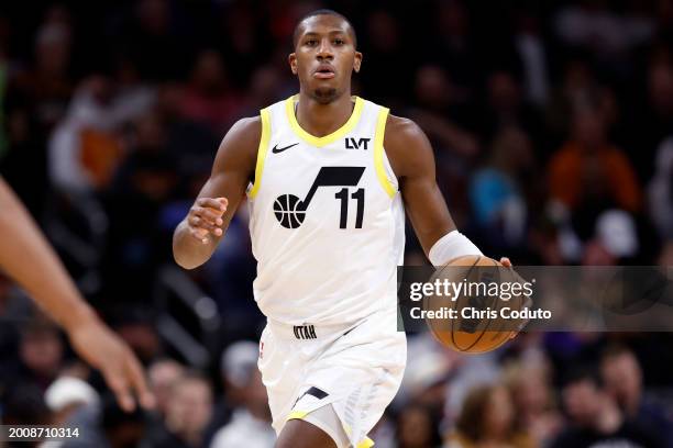 Kris Dunn of the Utah Jazz controls the ball during the game against the Phoenix Suns at Footprint Center on February 08, 2024 in Phoenix, Arizona....