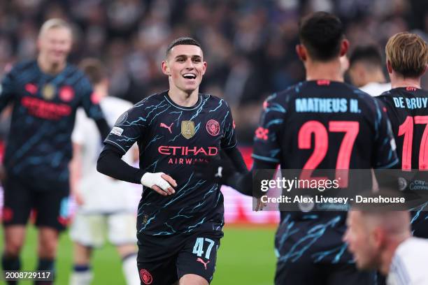 Phil Foden of Manchester City celebrates after scoring his side's third goal during the UEFA Champions League 2023/24 round of 16 first leg match...