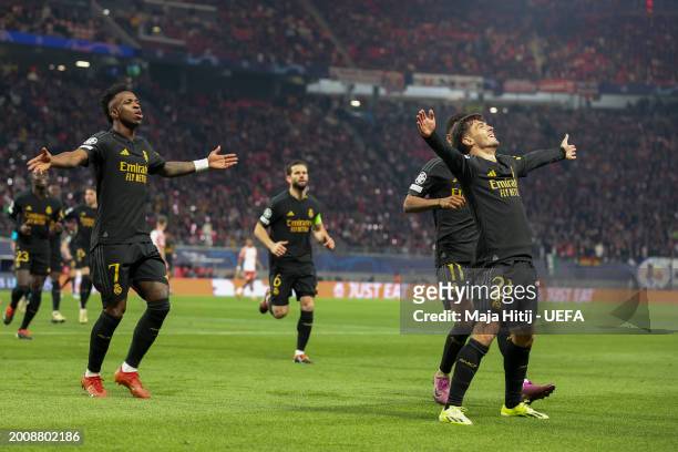 Brahim Diaz of Real Madrid celebrates with teammates after scoring his team's first goal during the UEFA Champions League 2023/24 round of 16 first...