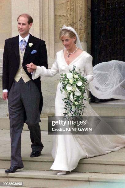 British Prince Edward and Sophie Rhys-Jones leave St George's Chapel at Windsor after their wedding Saturday 19 June 1999 . EPA PHOTO MIRROR...