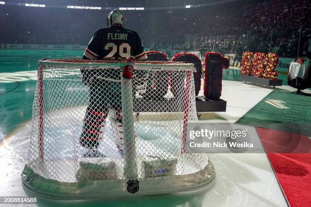 Marc-Andre Fleury of the Minnesota Wild is honored for playing in 1,000 career games and his 552nd career win before a game against the Pittsburgh...