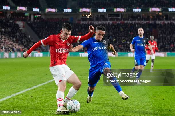 Hirving Lozano of PSV, Fredrik Oppegard of Heracles Almelo during the Dutch Eredivisie match between PSV v Heracles Almelo at the Philips Stadium on...