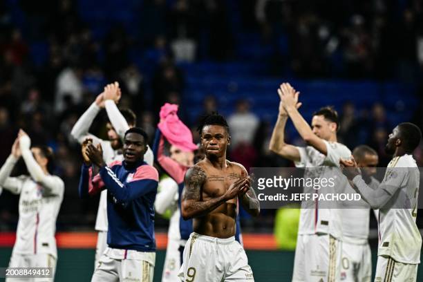 Lyon's Nigerian forward Gift Orban and teammates celebrate at the end of the French L1 football match between Olympique Lyonnais and OGC Nice at the...