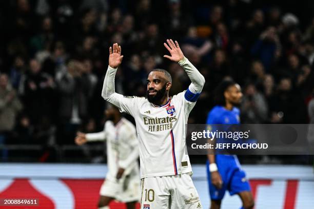 Lyon's French forward Alexandre Lacazette celebrates at the end the French L1 football match between Olympique Lyonnais and OGC Nice at the Groupama...