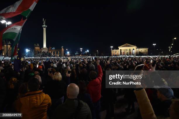 Protesters are holding up their phone torches during a protest demanding reforms of the child protection system after the Hungarian President...