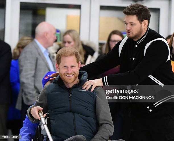 Britain's Prince Harry, Duke of Sussex, and Canadian singer Michael Bublé attend the "Invictus Games Vancouver Whistler 2025's One Year to Go" winter...