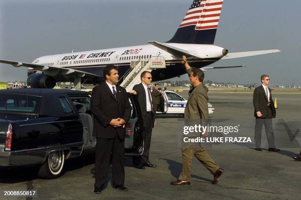 Democratic presidential candidate US Vice President Al Gore walks in front of Republican rival George W. Bush's campaign plane upon his arrival 03...