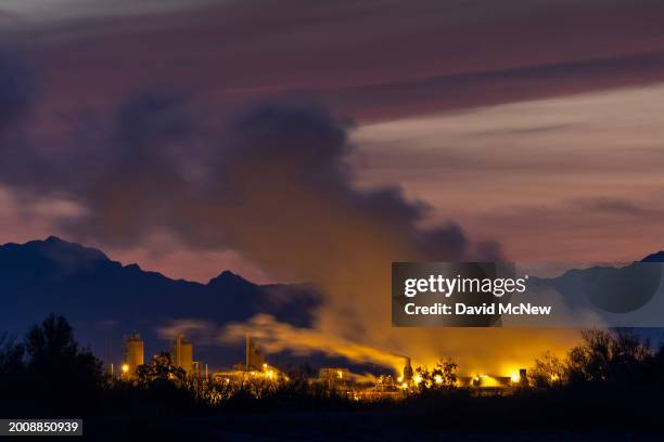 In an aerial view, steam rises from fumaroles, or steam vents, situated between two of the five Salton Buttes lava dome volcanoes that line the...