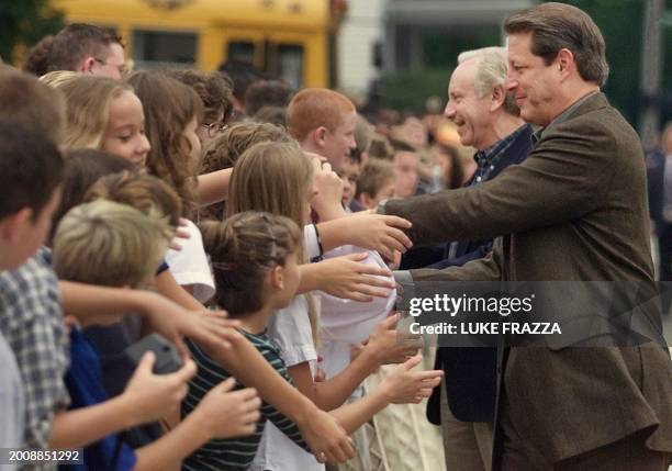 Vice President and Democratic presidential candidate Al Gore and his running mate US Senator Joe Lieberman , D-CT, greets students outside the Anna...