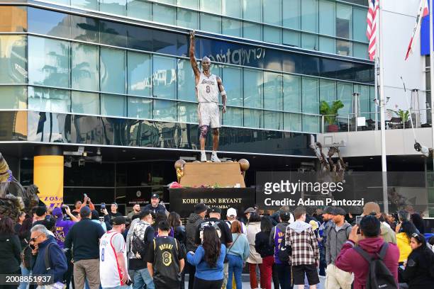 Fans gather outside Crypto.Com Arena around the statue of Kobe Bryant before the game between the New Orleans Pelicans and the Los Angeles Lakers on...