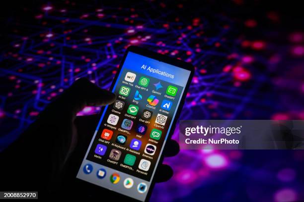 An AI-powered app icon, similar to those of Bing, Gemini, OpenAI, Chatbot, and Copilot, is being displayed on a smartphone among other applications...