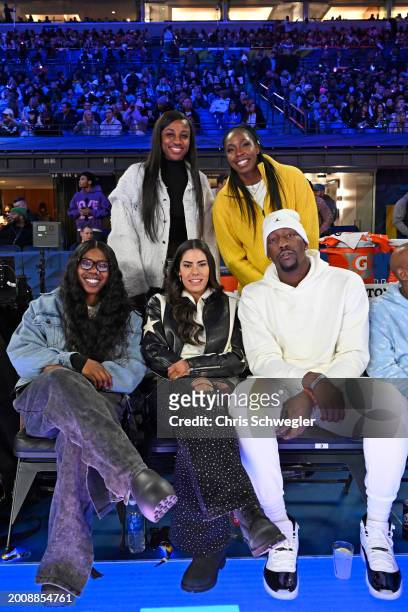 Bam Adebayo of the Miami Heat, Kelsey Plum, Jackie Young and Chelsea Gray of the Las Vegas Aces, and Arike Ogunbowale of the Dallas Wings during the...