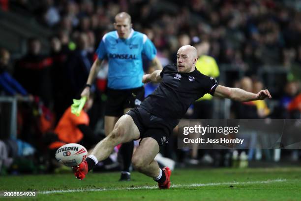 Lee Kershaw of London Broncos keeps the ball in play during the Betfred Super League match between St Helens and London Broncos at Totally Wicked...