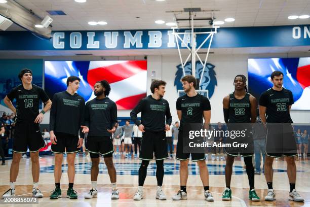 Romeo Myrthil , Cade Haskins and teammates of the Dartmouth Big Green line up before their game against Columbia Lions in their NCAA men's basketball...