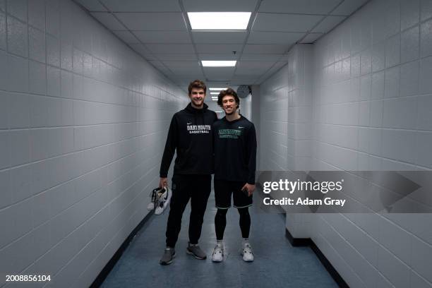 Cade Haskins and Romeo Myrthil of the Dartmouth Big Green, who are working to unionize their team, pose for a photograph after their game against...