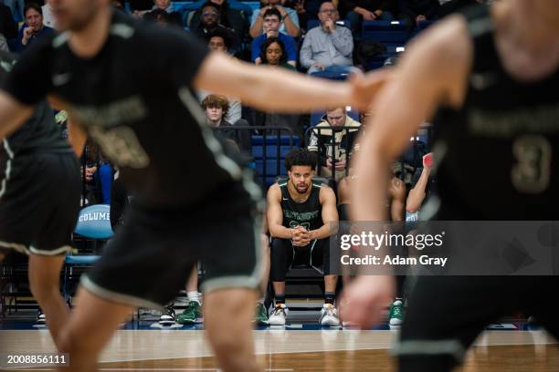 Robert McRae III of the Dartmouth Big Green watches his team play against Columbia Lions in their NCAA men's basketball game on February 16, 2024 in...