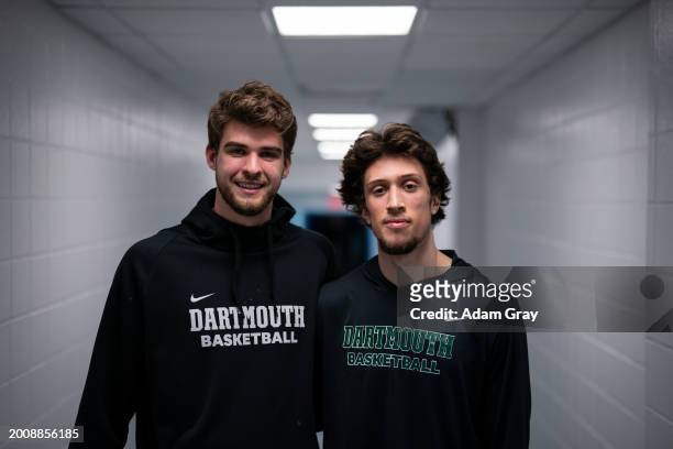 Cade Haskins and Romeo Myrthil of the Dartmouth Big Green, who are working to unionize their team, pose for a photograph after their game against...