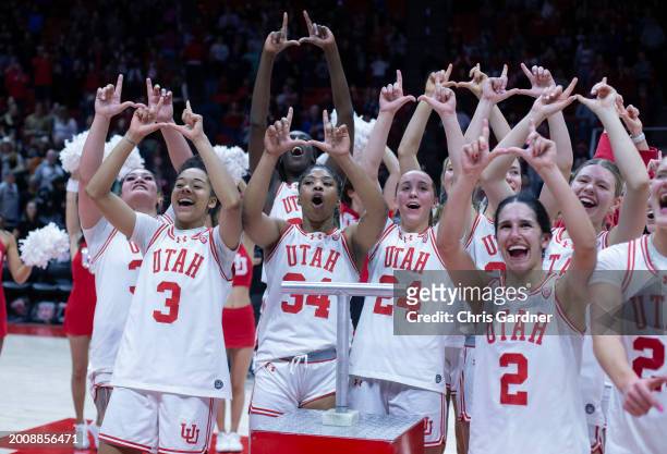 Alissa Pili, Lani White, Dasia Young, Kennady McQueen, Inez Vieira, Reese Ross, and Nene Sow of the Utah Utes celebrate their upset win over the...