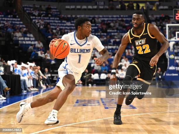 St. Louis guard Clan Medley drives to the basket as Virginia Commonwealth guard Joe Jamisile defends during a college basketball game between the...