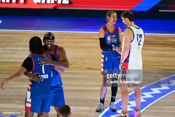 Members of Team Stephen A greet members of Team Shannon during the Ruffles NBA All-Star Celebrity Game as part of NBA All-Star Weekend on Friday,...