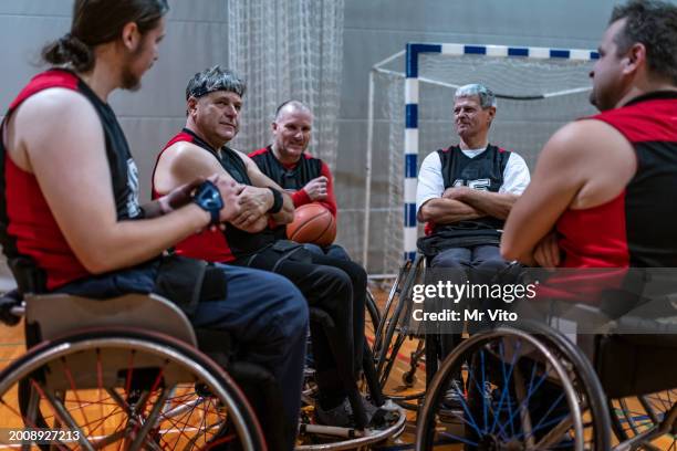 a team of disabled paraplegic basketball players in training - training wheels stock pictures, royalty-free photos & images