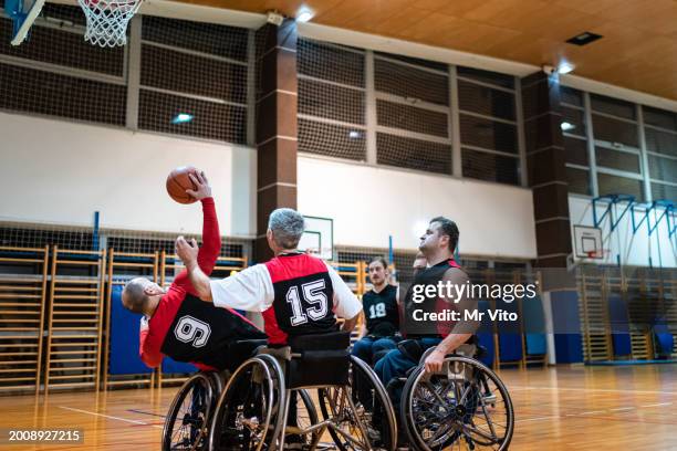 a team of disabled paraplegic basketball players in training - training wheels stock pictures, royalty-free photos & images