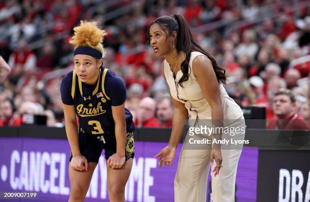 Niele Ivey the head coach of the Notre Dame Fighting Irish gives instructions to Hannah Hidalgo against the Louisville Cardinals during the second...
