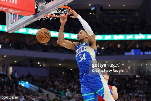 Giannis Antetokounmpo of the Milwaukee Bucks dunks against the Miami Heat during the first half of a game at Fiserv Forum on February 13, 2024 in...