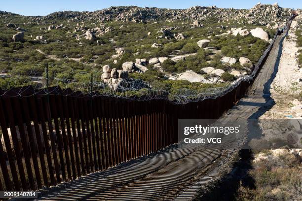 Part of the US-Mexico border fence on February 13, 2024 in Jacumba Hot Springs, San Diego, California.