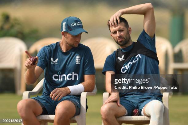 Joe Root and Mark Wood of England look on during the England Net Session at Saurashtra Cricket Association Stadium on February 13, 2024 in Rajkot,...