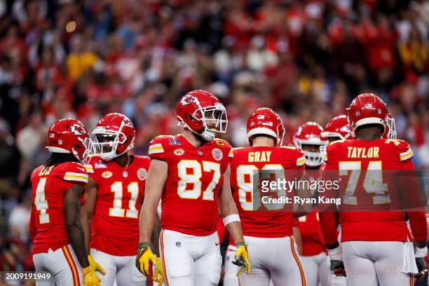 Travis Kelce of the Kansas City Chiefs looks on from the huddle during Super Bowl LVIII against the San Francisco 49ers at Allegiant Stadium on...