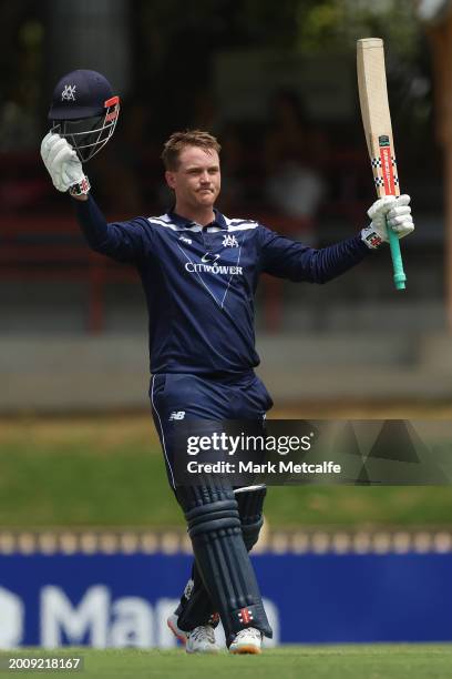 Tom Rogers of Victoria celebrates and acknowledges the crowd after scoring a century during the Marsh One Day Cup match between New South Wales and...