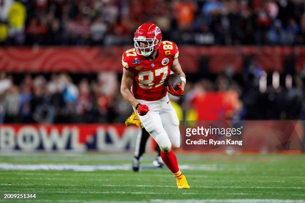 Travis Kelce of the Kansas City Chiefs runs the ball after a catch during Super Bowl LVIII against the San Francisco 49ers at Allegiant Stadium on...