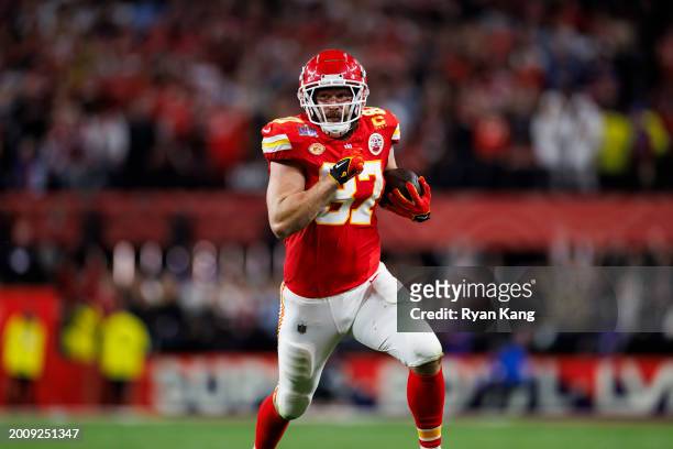 Travis Kelce of the Kansas City Chiefs runs the ball after a catch during Super Bowl LVIII against the San Francisco 49ers at Allegiant Stadium on...