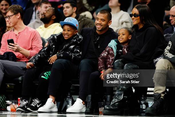 Future Zahir Wilburn, American football quarterback Russell Wilson, Sienna Princess Wilson, and singer Ciara attend the game between the Brooklyn...