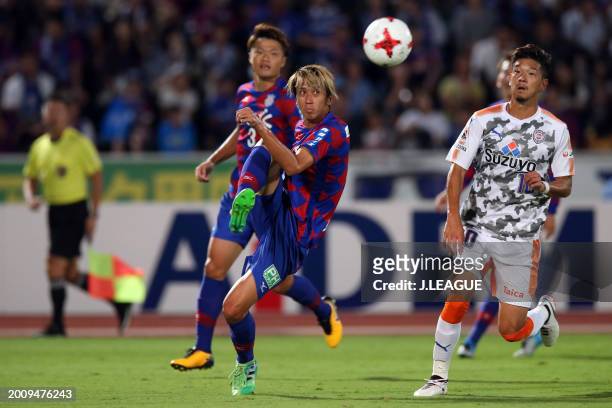 Ryohei Arai of Ventforet Kofu controls the ball against Ryohei Shirasaki of Shimizu S-Pulse during the J.League J1 match between Ventforet Kofu and...
