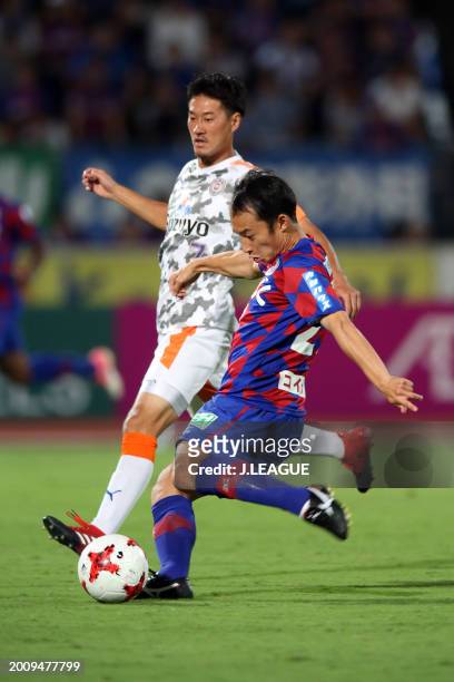 Shohei Abe of Ventforet Kofu controls the ball against Mitsunari Musaka of Shimizu S-Pulse during the J.League J1 match between Ventforet Kofu and...