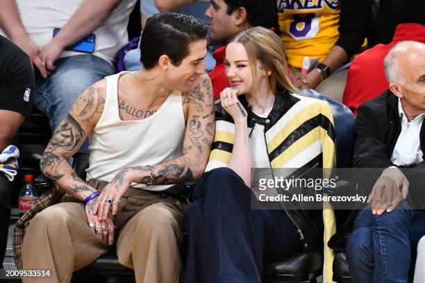 Damiano David and Dove Cameron attend a basketball game between the Los Angeles Lakers and the Detroit Pistons at Crypto.com Arena on February 13,...
