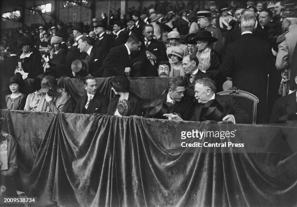 British Royal Edward, Prince of Wales, in conversation with French politician Gaston Doumergue, President of France, during the opening ceremony of...