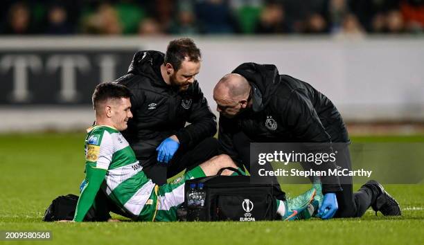 Dublin , Ireland - 16 February 2024; Trevor Clarke of Shamrock Rovers receives medical attention from physiotherapist Tony McCarthy, right, and team...