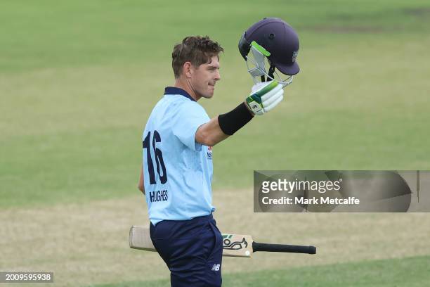 Daniel Hughes of the Blues celebrates and acknowledges the crowd after scoring a century during the Marsh One Day Cup match between New South Wales...
