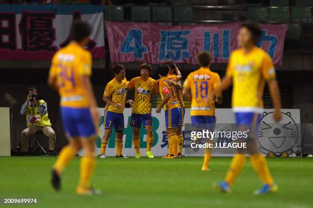 Naoki Ishihara of Vegalta Sendai celebrates with teammates after scoring the team's first goal during the J.League J1 match between Vegalta Sendai...