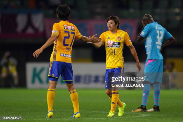 Naoki Ishihara of Vegalta Sendai celebrates with teammate Kazuki Oiwa after scoring the team's first goal during the J.League J1 match between...