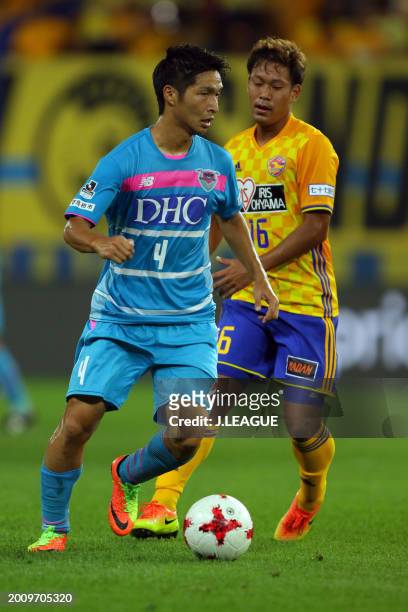 Riki Harakawa of Sagan Tosu controls the ball against Gakuto Notsuda of Vegalta Sendai during the J.League J1 match between Vegalta Sendai and Sagan...