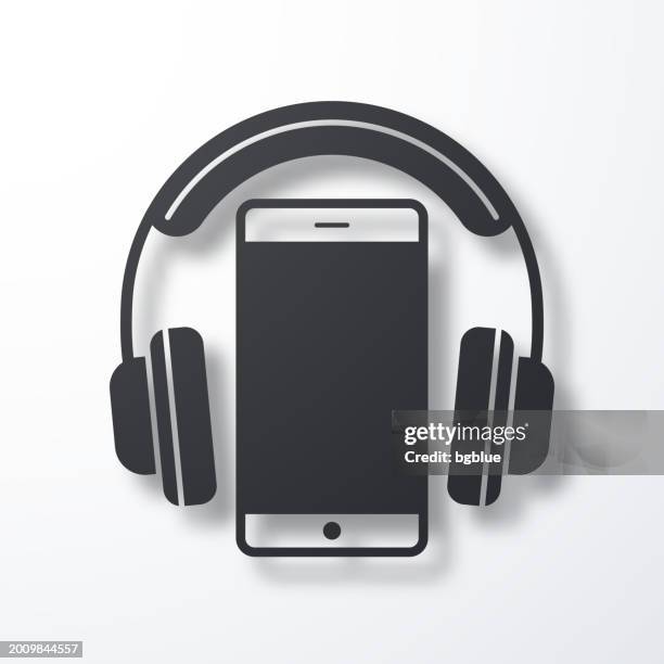 headphones with smartphone. icon with shadow on white background - wireless headphones white background stock illustrations